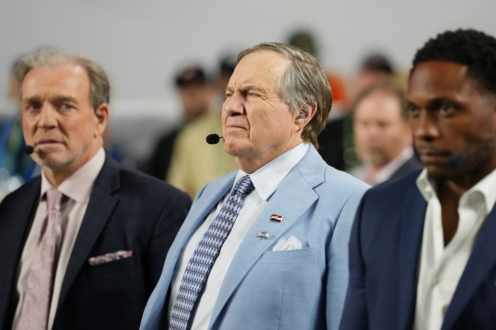 TV analyst Bill Belichick watches the Miami Hurricanes play the Indiana Hoosiers during the first half of the College Football Playoff National Championship game at Hard Rock Stadium.