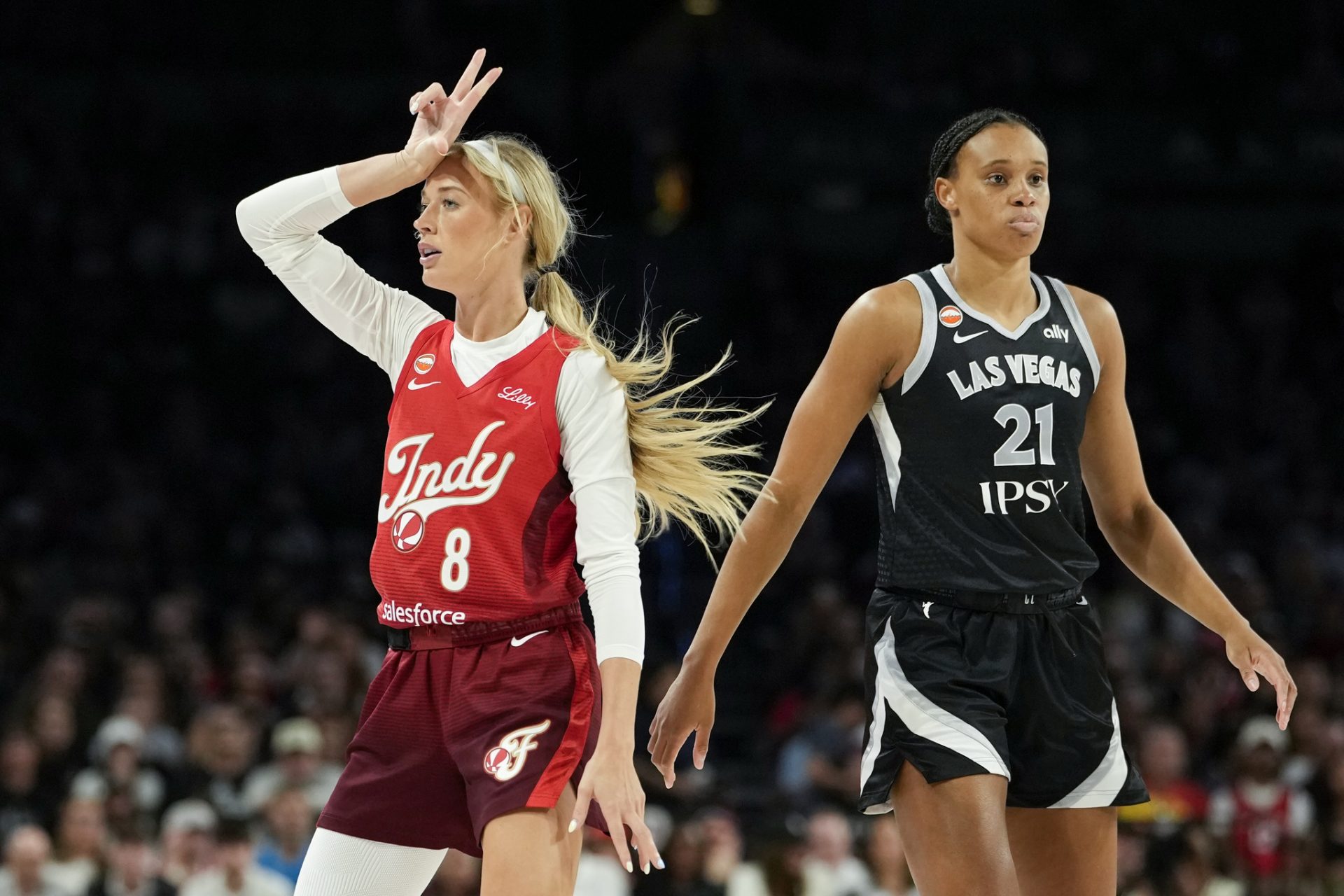 Indiana Fever guard Sophie Cunningham (8) reacts after scoring against Las Vegas Aces forward-center Brianna Turner  - Source: Imagn Images
