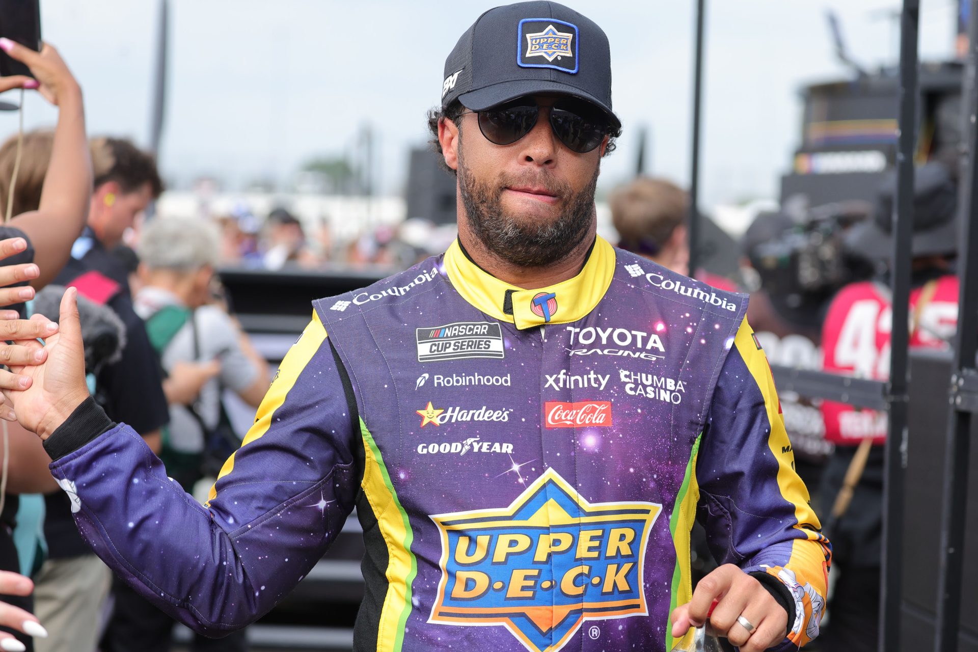NASCAR Cup Series driver Bubba Wallace (23) shakes hands with fans before the eero 400 at Chicagoland Speedway.
